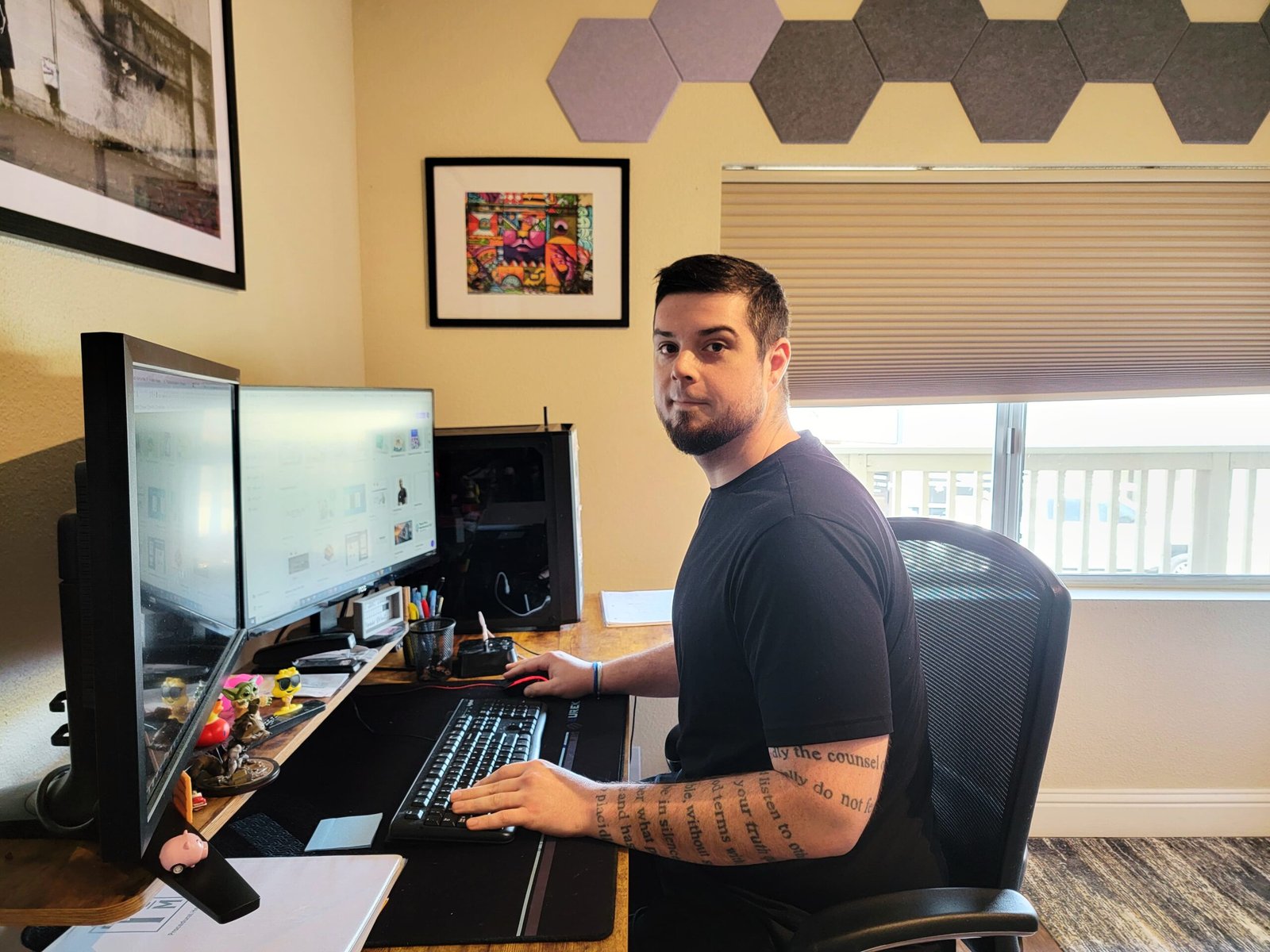 portrait image of Adam at his desk
